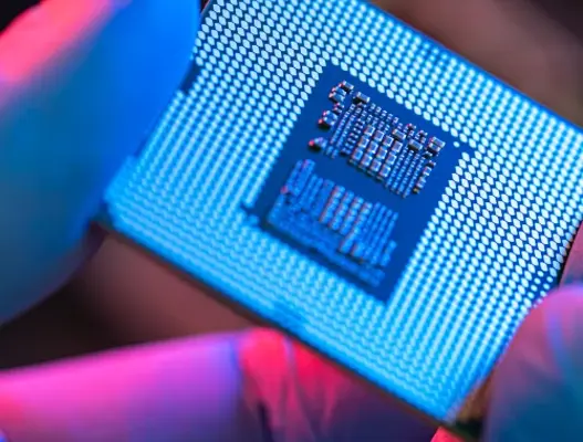 Fingers holding semiconductor chip